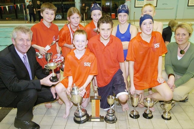 Scarborough Swimming Club members with coaches Simon Deller, left, and Bridget Marshall, right, presenting awards in 2006.