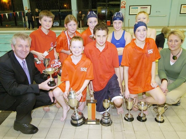 Scarborough Swimming Club members with coaches Simon Deller, left, and Bridget Marshall, right, presenting awards in 2006.