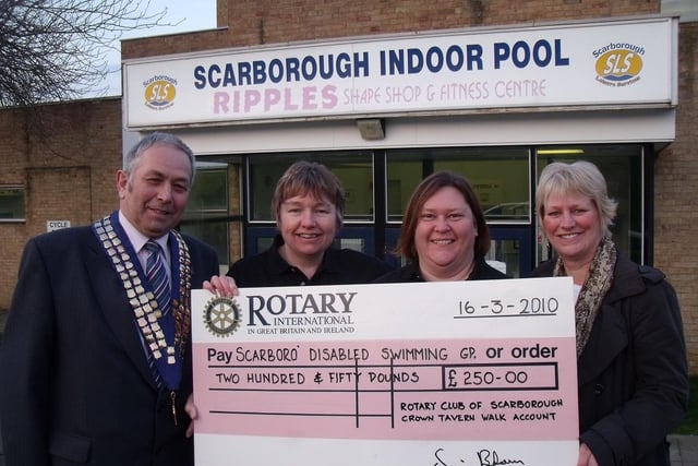 Scarborough Rotary Club President Simon Green, Wendy Cook and Julie Knight from the Disabled Swimming Group, and Rotary Crown Tavern Walk Committee Chairman Jane Moment in 2010; the club had been handed an additional boost with Gift-aided cash from the annual walk.