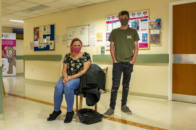 A volunteer was sat at the entrance handing out masks for people coming into the wing, and visitors wore masks in the waiting area such as here