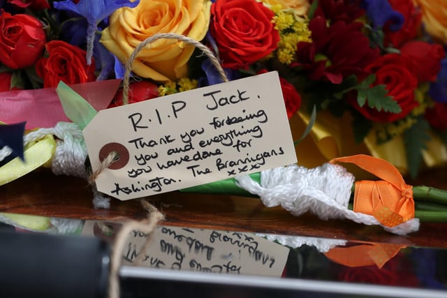 Floral tributes in the hearse included a football and a red England shirt with Jackie 5 on it.