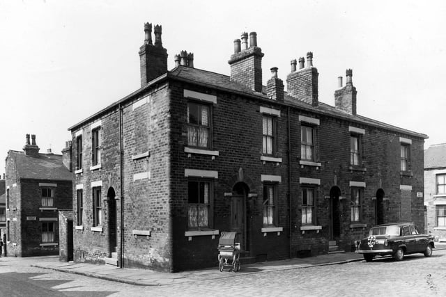 Fertile Terrace in May 1960 which was located between Nippet Terrace, seen here on the left and Perth Street to the right. A city of Leeds registered taxi is parked in the street.