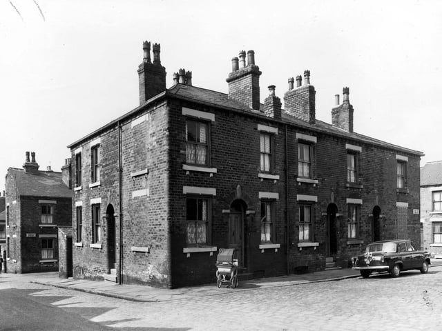 Fertile Terrace in May 1960 which was located between Nippet Terrace, seen here on the left and Perth Street to the right. A city of Leeds registered taxi is parked in the street.