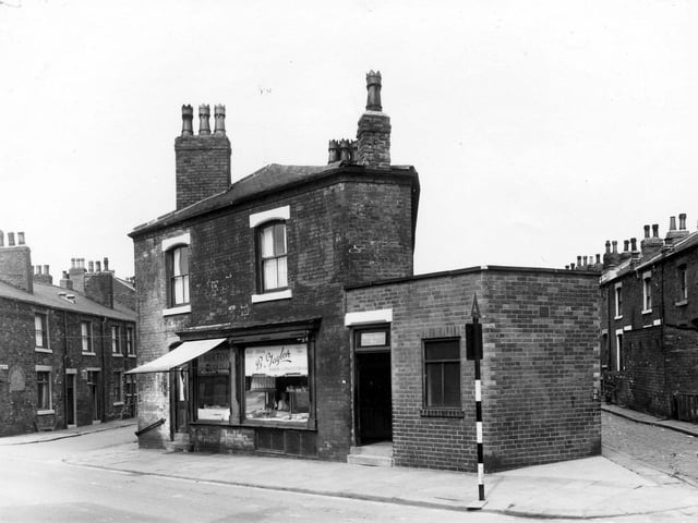 On the left is East Beckett Street. Number 98 Accommodation Road is a fresh fish shop. To the right is a bakers shop.