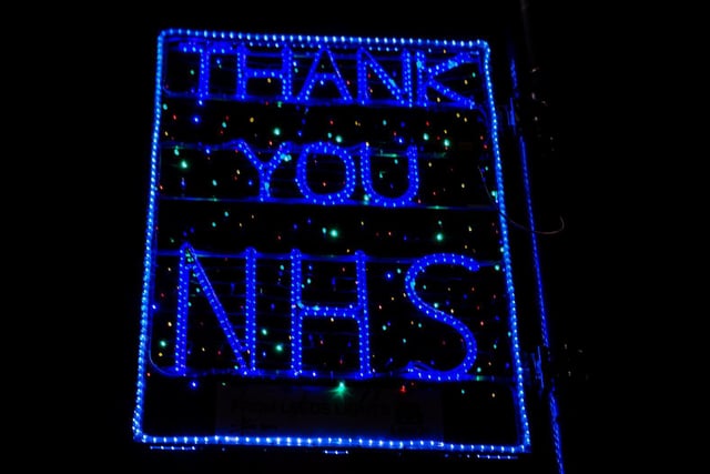 Buildings have been lit in blue, as a tribute to the NHS staff working in hospitals and care settings