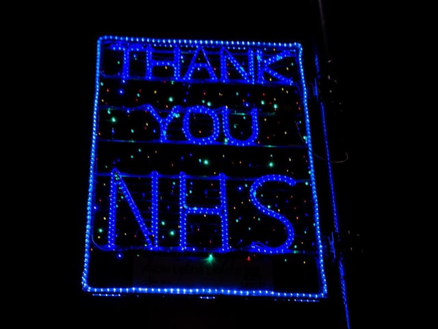 Buildings have been lit in blue, as a tribute to the NHS staff working in hospitals and care settings