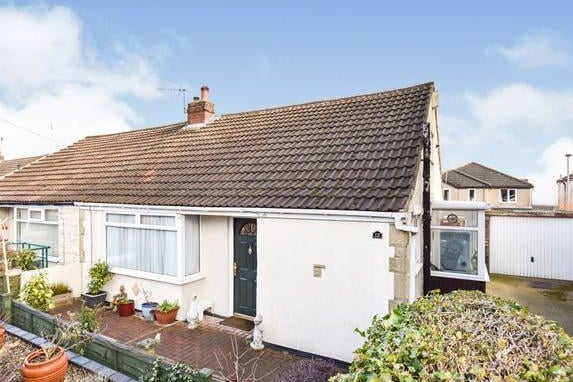 This two bedroom bungalow on Highfield Street, is up for sale by auction.  It has two double bedrooms, a lounge filled with natural light and a feature fireplace and a landscaped back garden. The starting bid is £150,000 and the home is being marketed by William H Brown.
