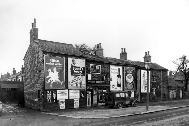 W. & H. Aspinall's grocers on Cross Gates Road in 1956. On the left, a small window display advertises A.W. Bulmer, wedding photographer.