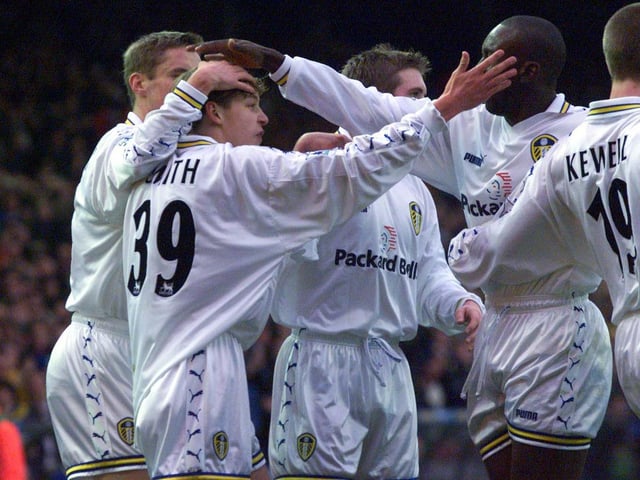 Alan Smith celebrates with teammate after opening the scoring. PIC: Varley Picture Agency
