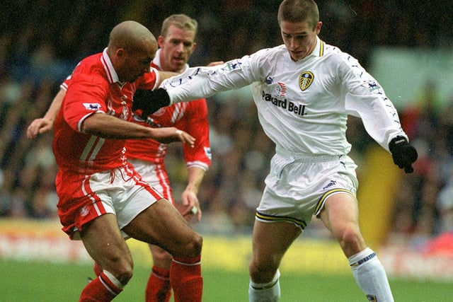 Harry Kewell keeps Middlesbrough's Curtis Fleming at arms length.