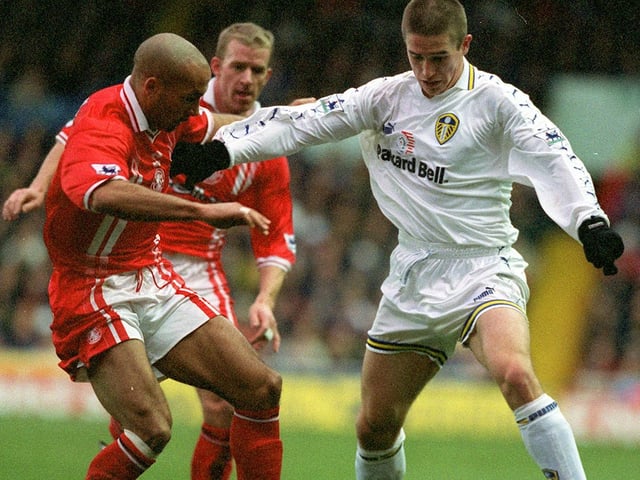 Harry Kewell keeps Middlesbrough's Curtis Fleming at arms length.