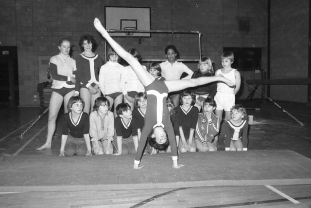 The world may watch the Russian and Romanian gymnasts and gasp in wonder and admiration. But the Garstang gymnasts have a lot more fun. Garstang Gymnasts Club is a typical example of the many clubs which have sprung up around the country and is run by a team of dedicated volunteers. Pictured: Eleven-year-old Laura Bolton demonstrates a cartwheel to the other members of the club