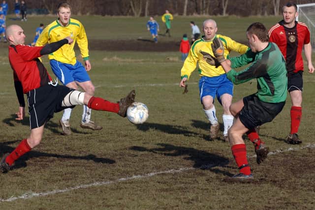 Rose of York v Kingstone United WMC, Wakefield and District League Division One. Kingstone defender Wayne Burke stretches to stop a Rose of York attack. 20 February 2010.