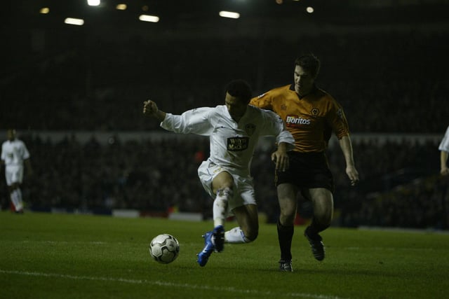 Jermaine Pennant holds off Wolves's Mark Kennedy.