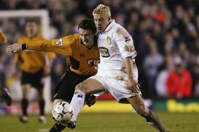 Alan Smith of Leeds clashes with Lee Naylor.