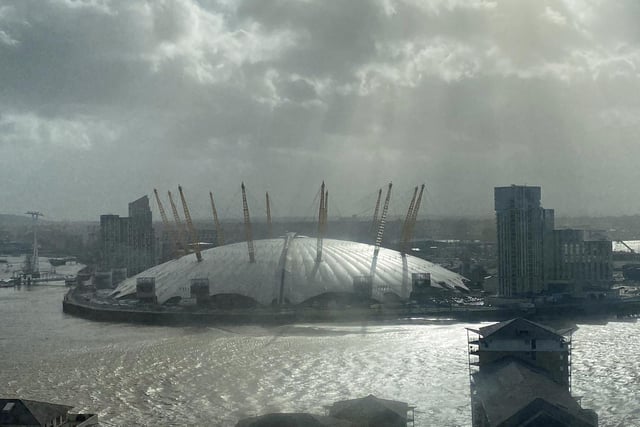 The Millenium Dome in Greenwich, south London, with roof panels missing (bottom right) after they were blown off in Storm Eunice