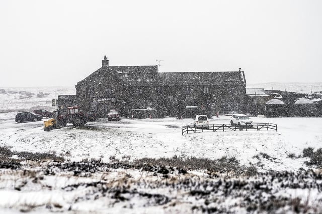 Tan Hill Inn, the England's highest pup at 1,732 feet (528m) above sea level, in North Yorkshire, surrounded by heavy snow