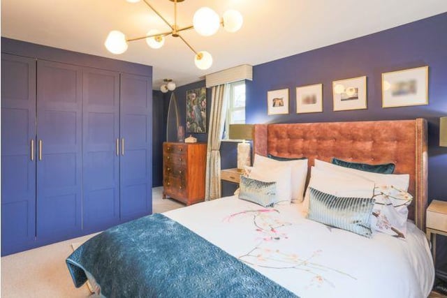 On the first floor are two bedrooms. Bedroom one has been painted a striking purple colour and has plenty of space for a large bed.