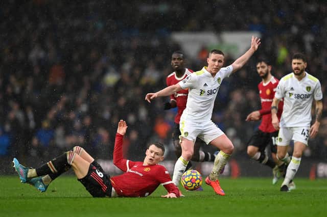 RUGGED: Adam Forshaw, centre, put in a tremendous shift for Leeds United in the middle of the park in Sunday's clash against Manchester United against the likes of Scott McTominay, left, at Elland Road. Photo by Shaun Botterill/Getty Images.