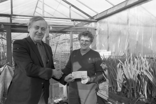 Housewife Yvonne Tomlinson found the Evening Post's "Three 'n' Easy' bingo a piece of cake by scooping the first of the £500 big money prizes. A delighted Mrs Tomlinson from Churchtown, near Garstang, said she never realised it could be so simple. She is pictured being presented with her winnings by Post public relations manager Mark Pattison