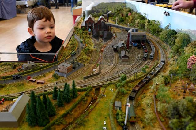 Sebastian Powley (aged three) watches one of the locomotives trundle around the Harrogate Model Rail Exhibition