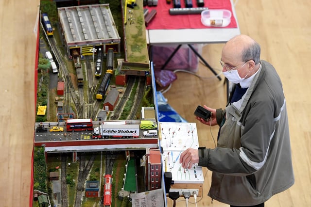 A visitor enjoying playing with one of the train displays