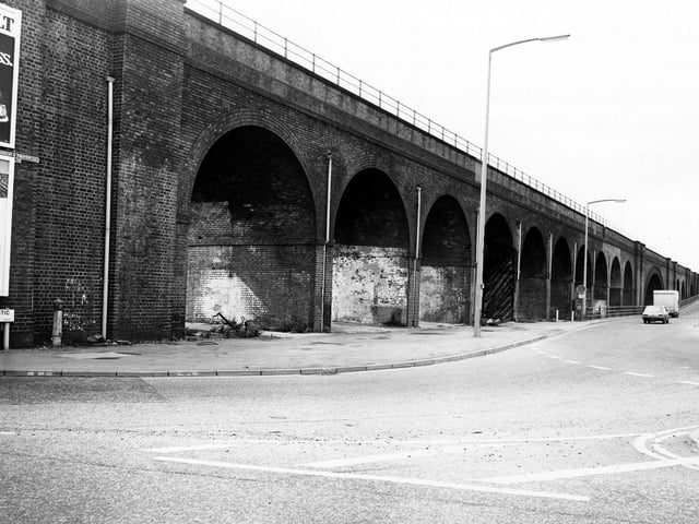 The railway viaduct which crosses Domestic Street pictured in February 1980. Domestic Road can be seen going off on the right. The proposed site for a new advertising hoarding is marked on the photograph in front of one of the arches.