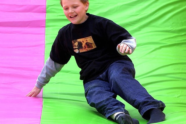 Charles Ashton age 11 from Harrogate enjoys the giant slide at Knaresborough's Spring Fayre.
