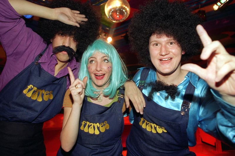 Getting down at 'Flares' 70's theme bar on Westgate in December 1997 are, from left, Daniel Edwards, Lynne Harmer and Julian Gaynor.
