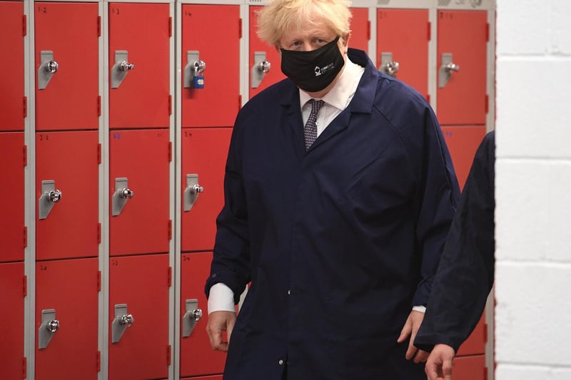 Boris Johnson enters the automotive shop during a visit to Kirklees College Springfield Sixth Form Centre. Photo: Getty Images
