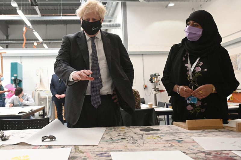 Boris Johnson learns about the screen-printing process in the arts and design area during a visit to Kirklees College Springfield Sixth Form Centre in Dewsbury. Photo: Getty Images
