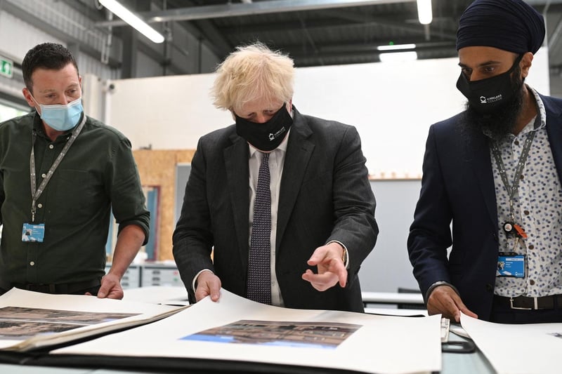 Prime Minister Boris Johnson chats with teachers in the arts and design area during a visit to Kirklees College Springfield Sixth Form Centre in Dewsbury. Photo: Getty Images