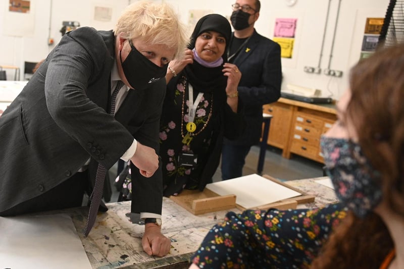 Mr Johnson meets students in the arts and design area during a visit to Kirklees College. Photo: Getty Images