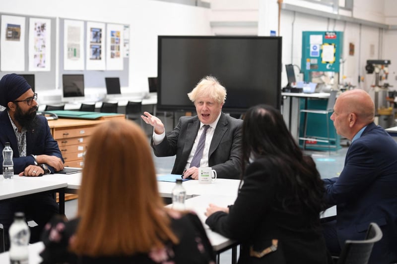 Mr Johnson chats with teachers in the arts and design area during a visit to Kirklees College. Photo: Getty Images