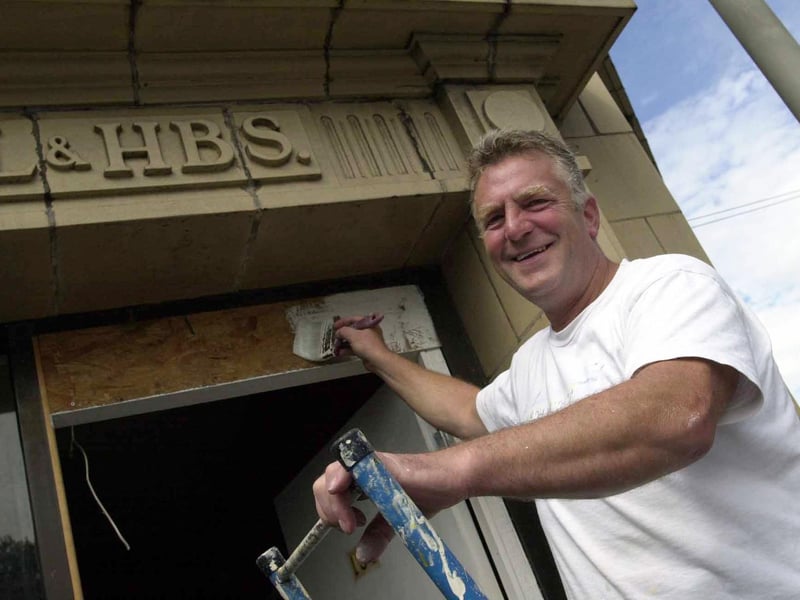 Malcolm Clark, chair of Holbeck Community Forum, at work in August 2000 finishing its new premises, the old Leeds and Holbeck Building Society offices on Domestic Street.