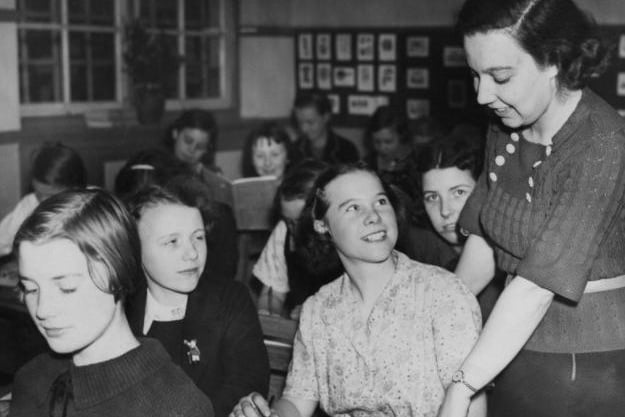 Teacher Alice Bacon (1909 - 1993) in a classroom at Normanton Senior School, Yorkshire, after being nominated as the Labour candidate for Leeds North East in the upcoming election, 19th October 1938.