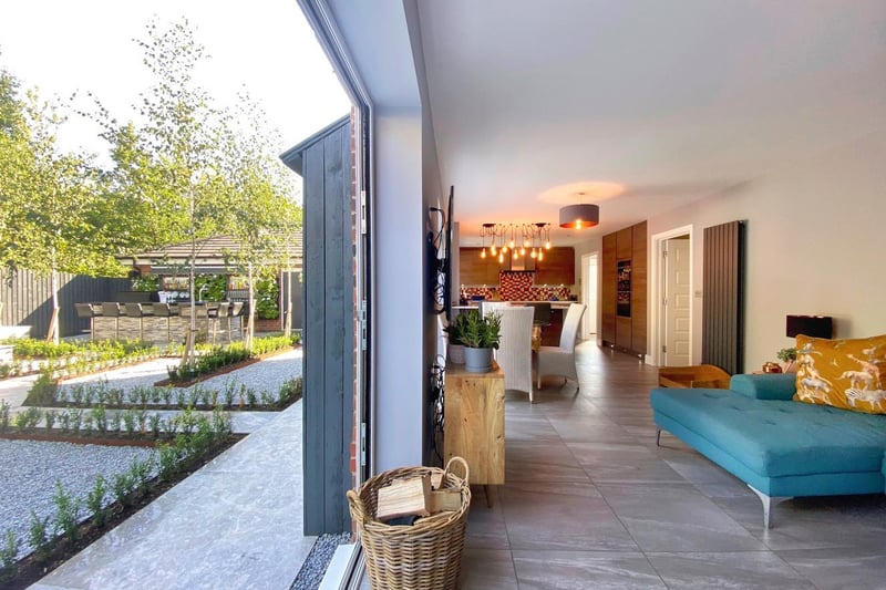 Outside, situated at the heart of the cul de sac, the property occupies a generous plot and has a driveway to the side