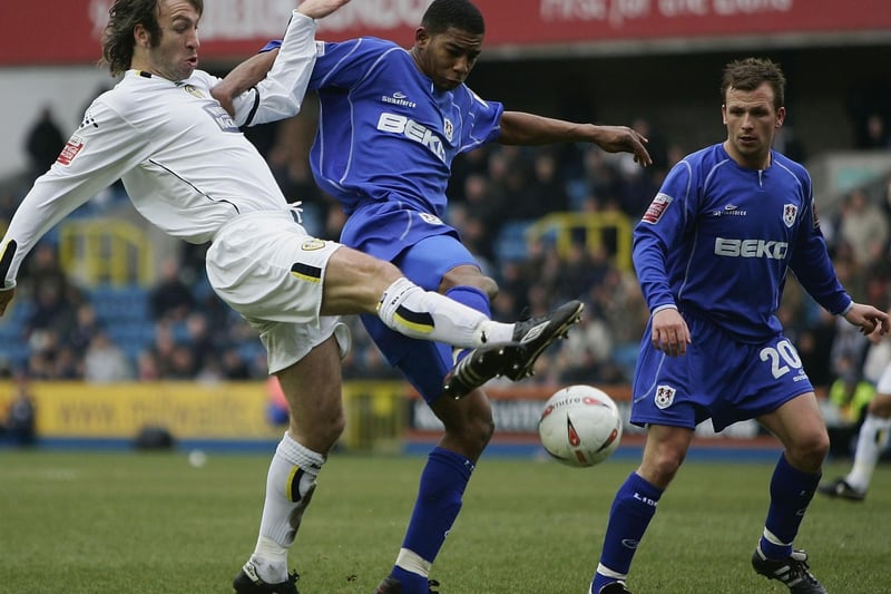 Shaun Derry battles for the ball with Millwall's Marvin Elliott during the Championship clash at The New Den in March 2005.