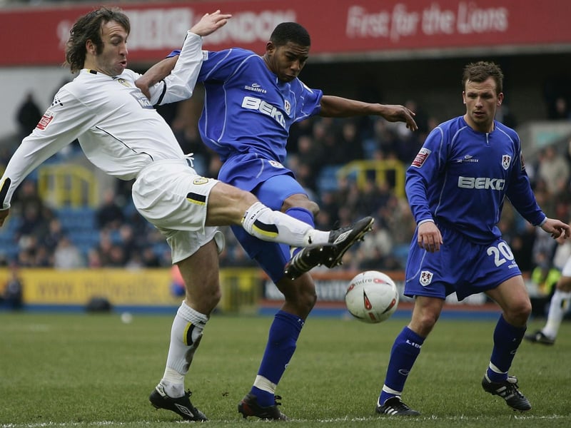 Shaun Derry battles for the ball with Millwall's Marvin Elliott during the Championship clash at The New Den in March 2005.