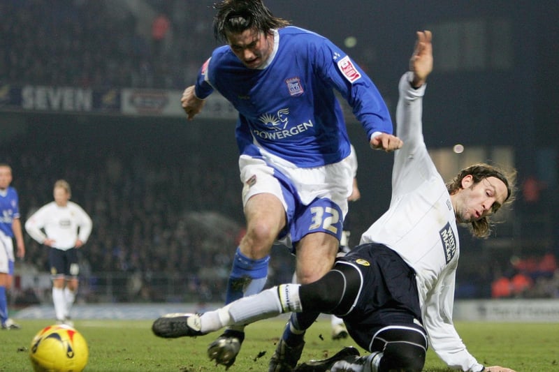 Shaun Derry tackles Ipswich Town's lan Lee during the Championship clash at Portman Road in January 2006.
