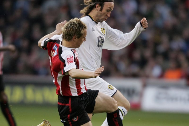 Sheffield United's Phil Jagielka tackles Shaun Derry during the Championship clash at Bramall Lane in April 2006.