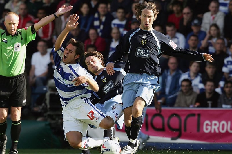 Shaun Derry tackles Lee Cook of Queens Park Rangers during the Championship clash at Loftus Road in September 2005.