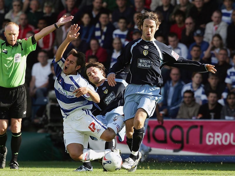 Shaun Derry tackles Lee Cook of Queens Park Rangers during the Championship clash at Loftus Road in September 2005.