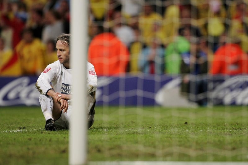 A dejected Shaun Derry sits on the pitch after conceding a penalty during the Championship play-off final against Watford at the Millennium Stadium in May 2006.