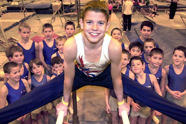 Oliver Kneen one of the City of Leeds Gymnastics team chosen to represent Great Britain. He is watched by some younger gymnasts who took part in the Yorkshire Championships.