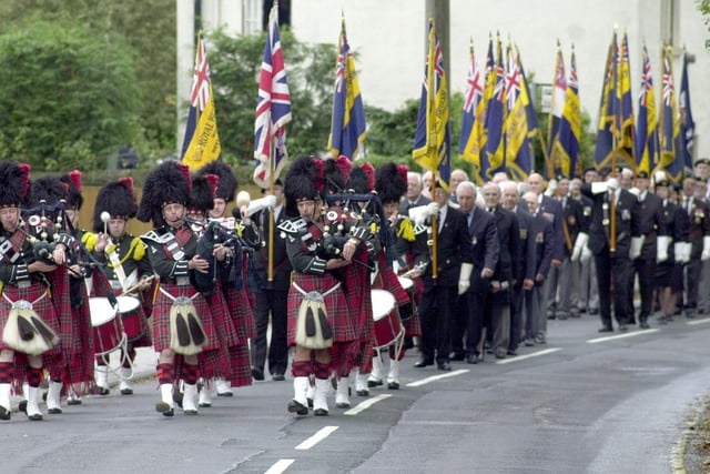 A dedication service for new war memorial and garden at Bramhope was held in the village. Pictured is The City of Leeds Pipe Band leading off the march.