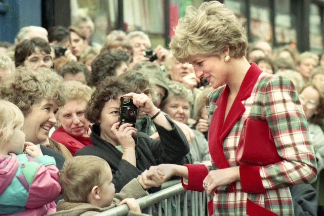 Princess Di shakes hands with well wishers in Mesnes Street during her visit to open the Galleries, Courthouse and new Town Hall on Monday 25th of November 1991.