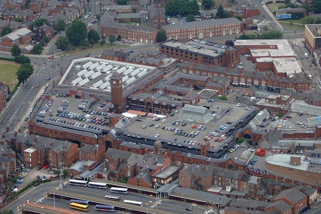 An Ariel photograph of The Galleries Shopping Centre, including Wigan Market, and Wigan Bus Station.