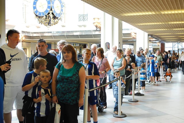 Latics fans queue to meet players Chris Kirkland and Gary Caldwell who signed autographs at the opening of the new Latics shop in the Galleries, Wigan - August 2010