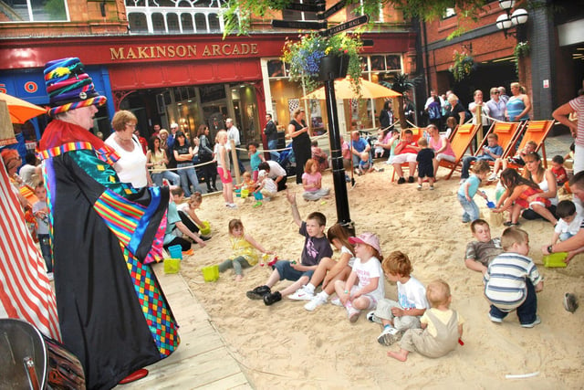 Entertainment on the Wigan beach which was first laid in July 2008.
Located in Woodcock Square at the Galleries Shopping Centre, 10 tonnes of sand were brought in and deck chairs  and decking put in situ.
The beach hosted a variety of activities and was free to anyone from late July to the end of August.
